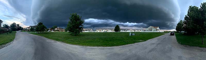 A cloud over a suburban street